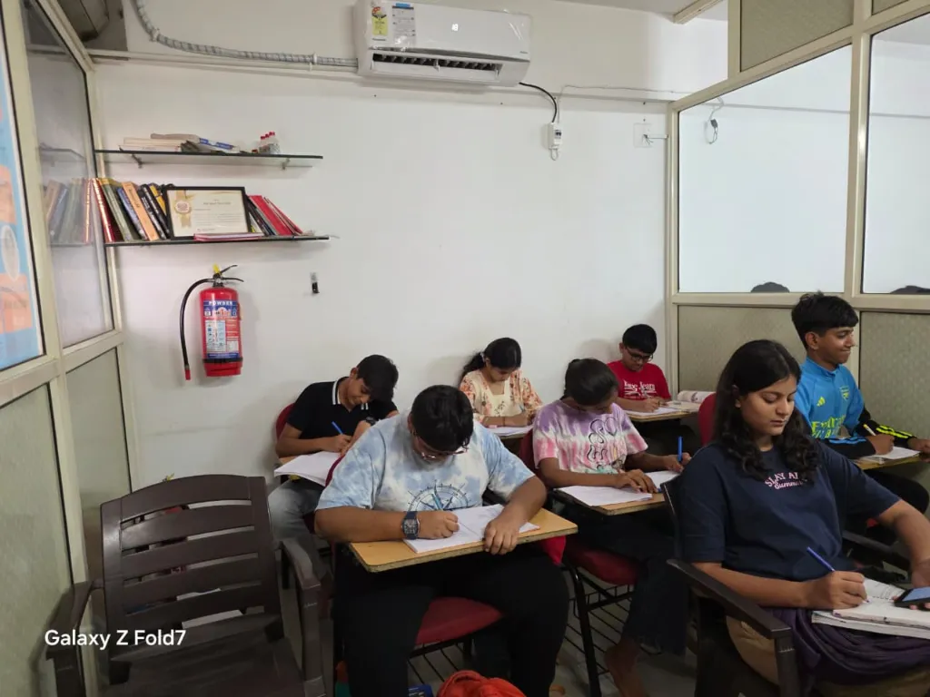 Students studying with notebooks and laptops in modern premium environment